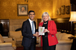 Amanda pictured with the Prime Minister Rishi Sunak and the winning Christmas card